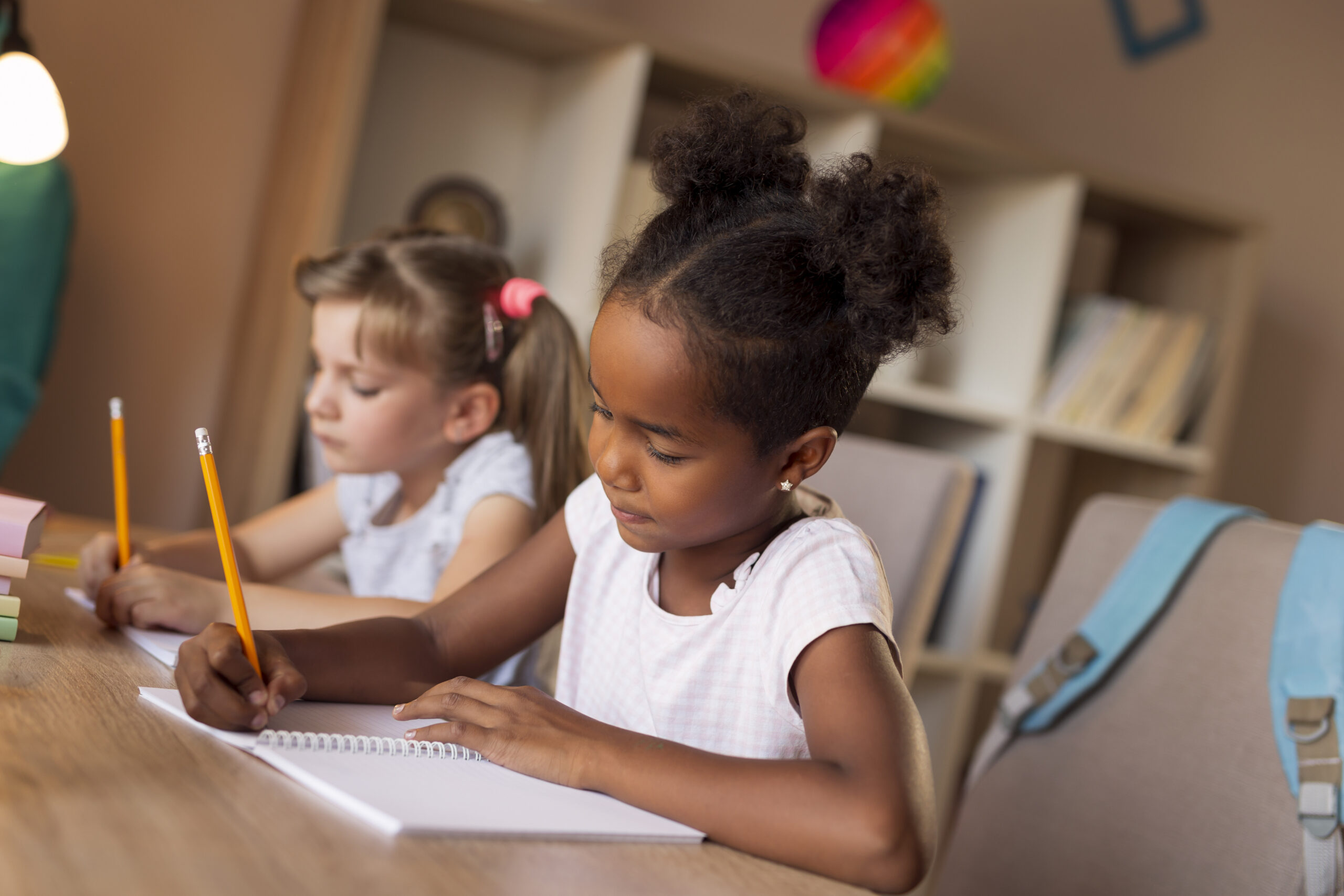 image of girls doing math homework