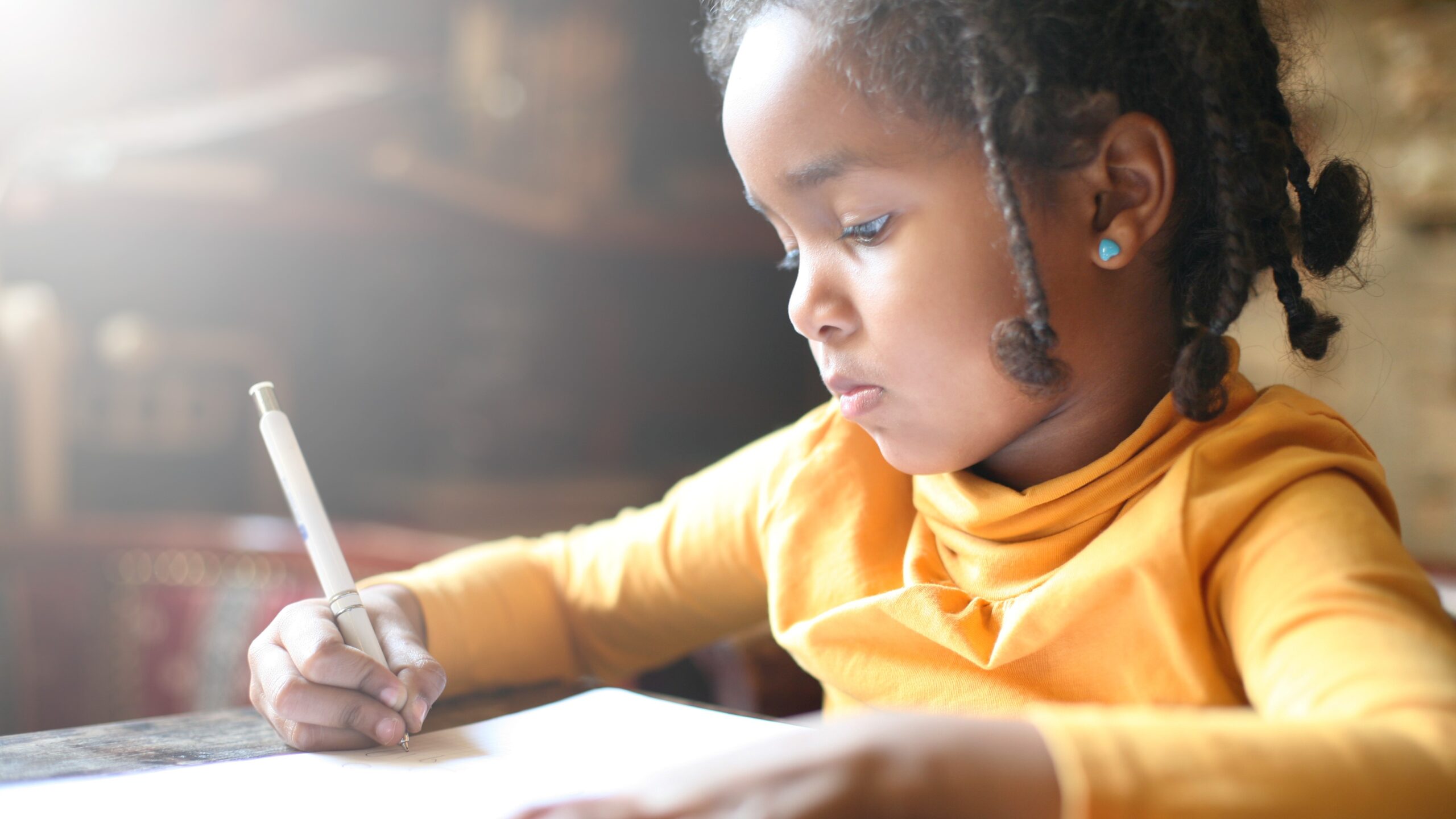 image of girl doing homework